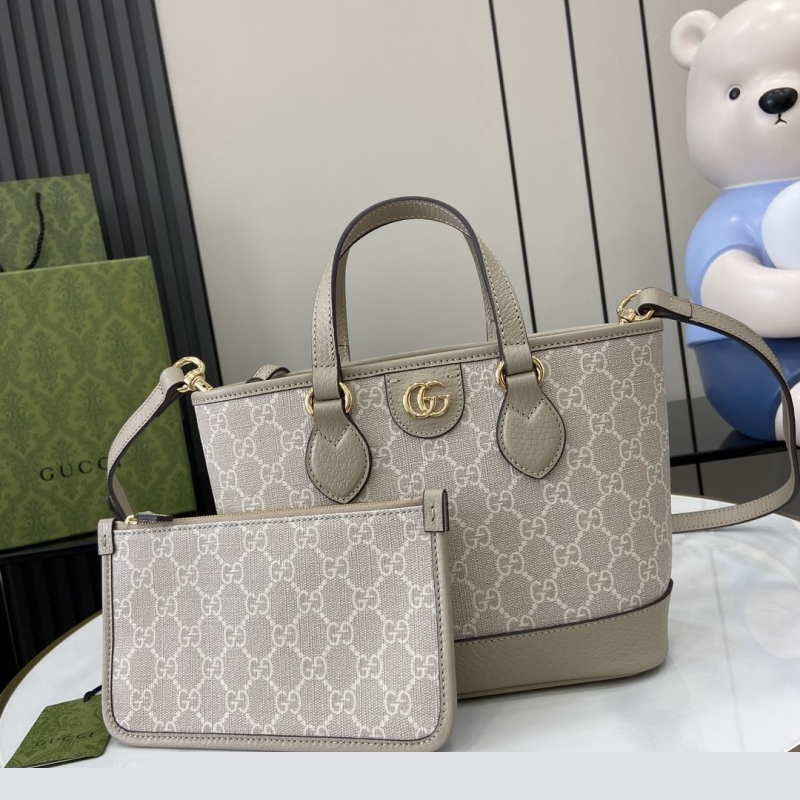 G*u*i shopping bags